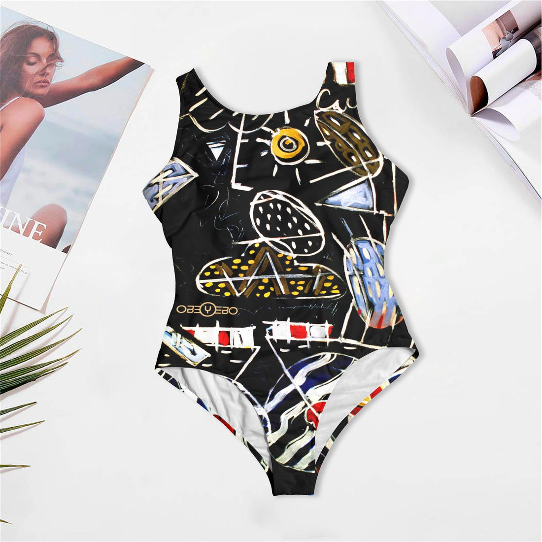 Stolen Women's One Piece Swimsuit by Philip Slagter on table